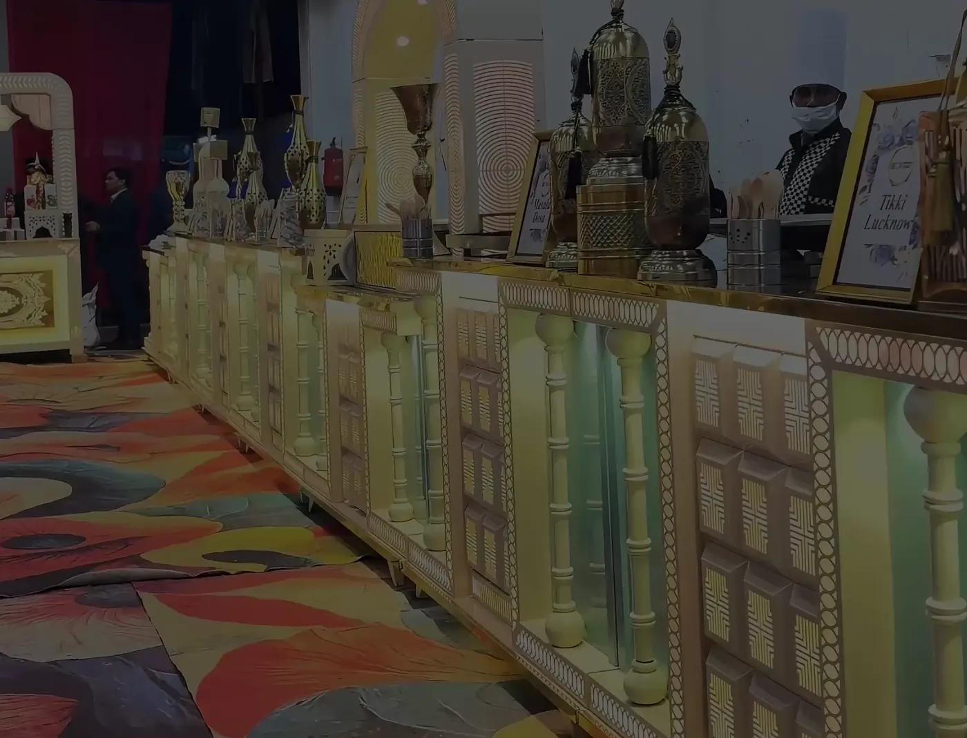 Long buffet counter with carved panels and warm lighting