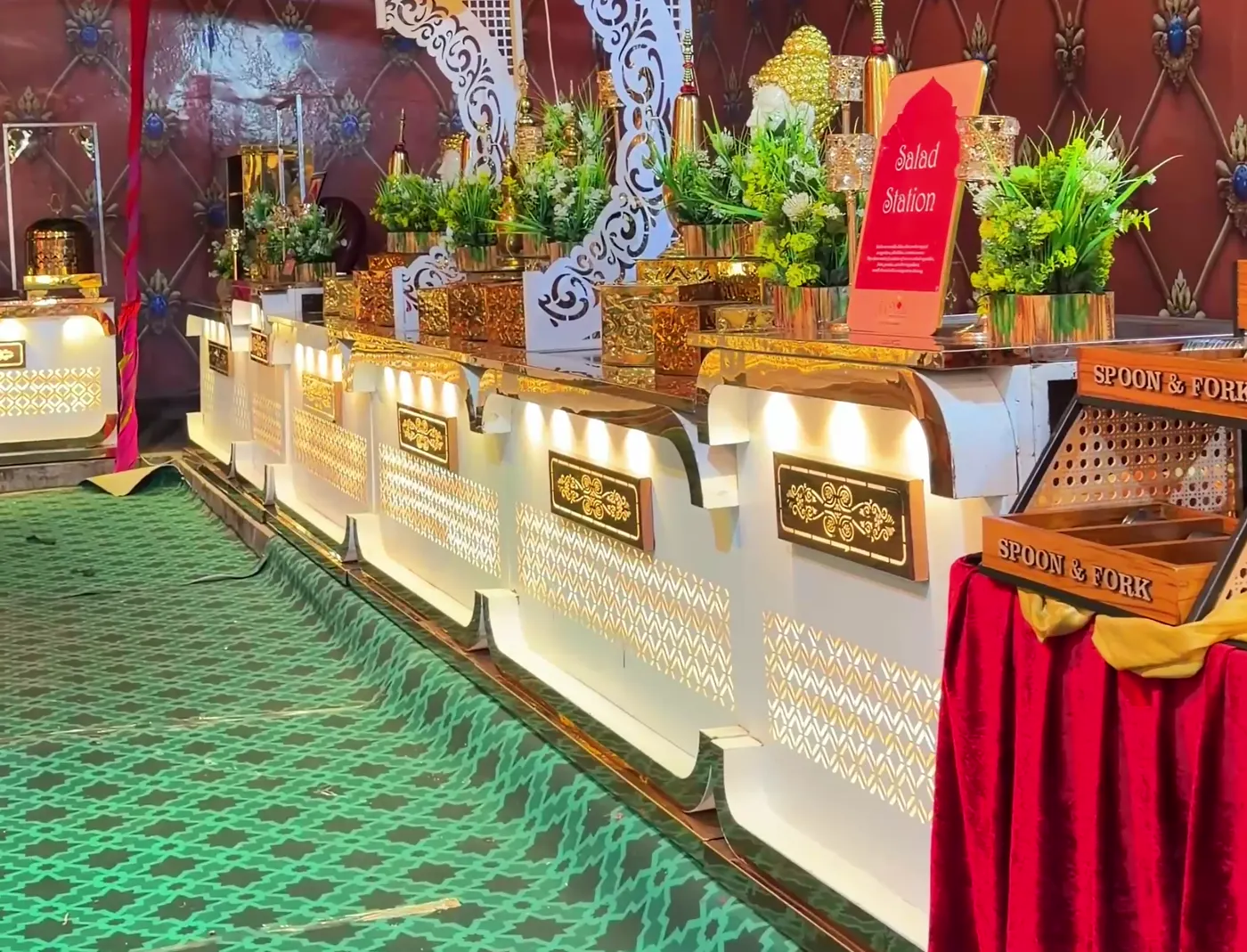 Full-length buffet setup with floral and brass details