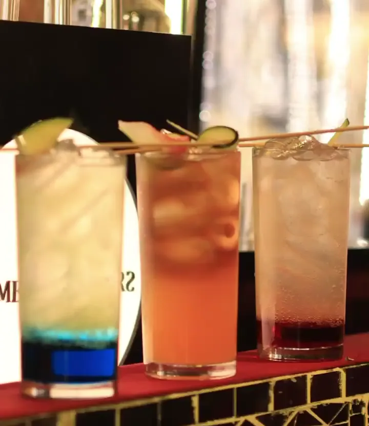 Three chilled beverages with garnish