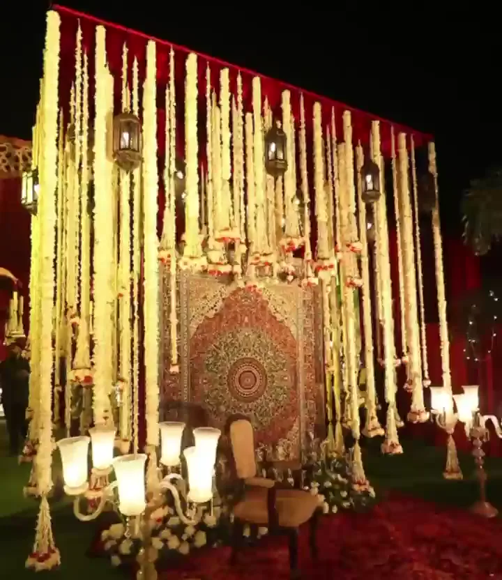 Floral backdrop with hanging flower strands at a Food Arcade event