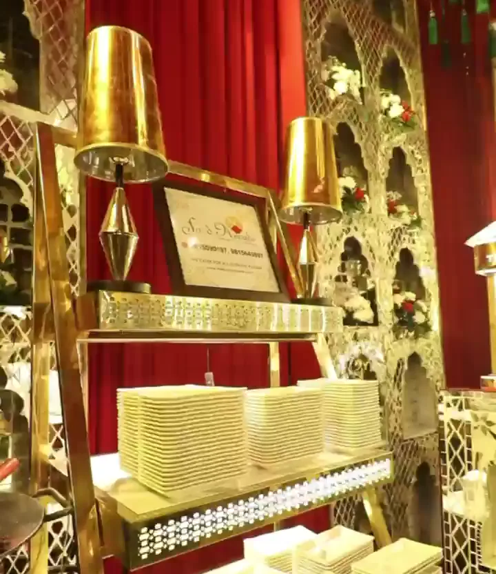 Stacked plates on a gold and white display stand